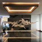 Transparent waves hanging in the air in the hotel lobby, artistic decorative resin ornaments hanging from the ceiling of the sales office in the shopping mall